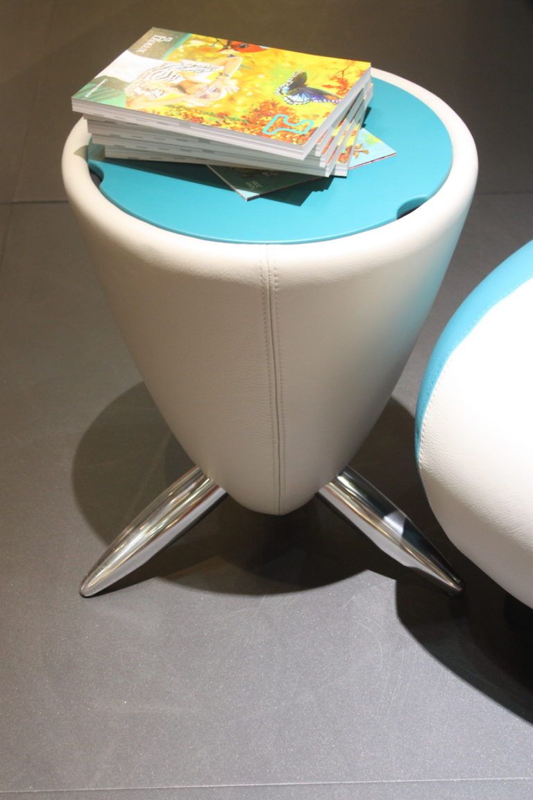 Stylish hidden storage areas help keep small space uncluttered.