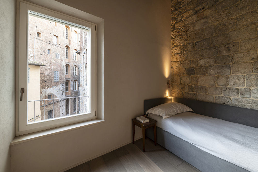 Minimalist Home Inside a Medieval Tower in Siena another bed