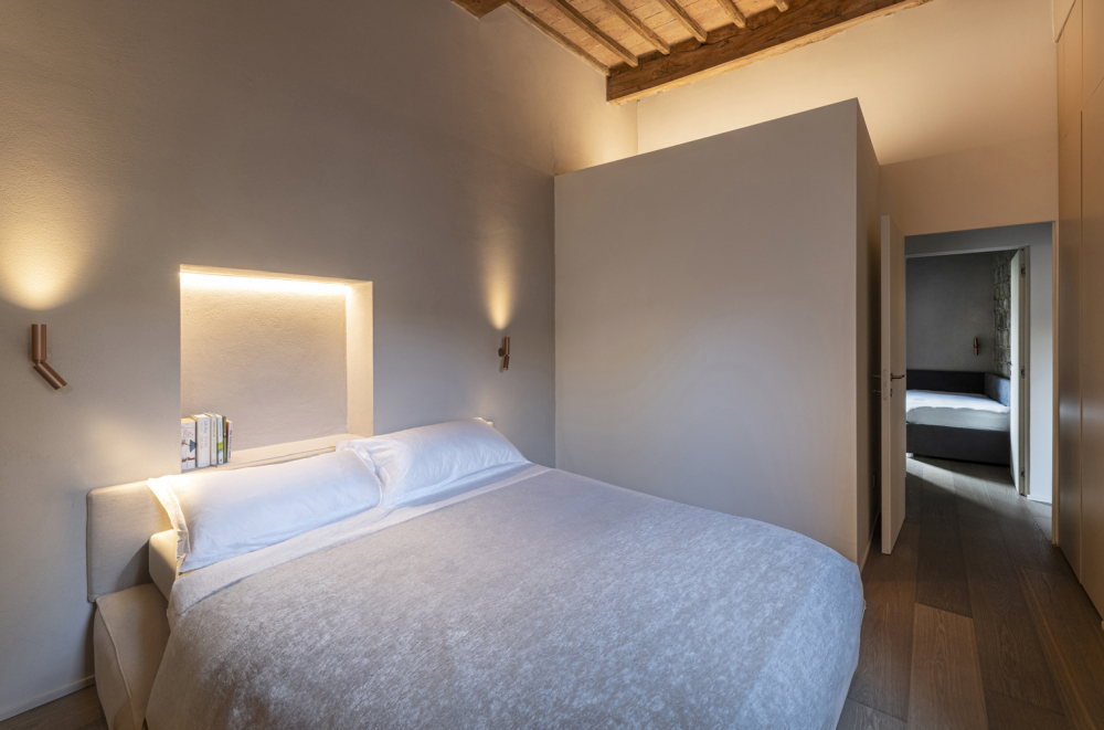 Minimalist Home Inside a Medieval Tower in Siena bedroom light niche