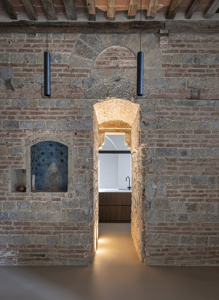 Minimalist Home Inside a Medieval Tower in Siena raw walls