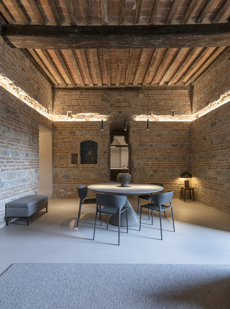 Minimalist Home Inside a Medieval Tower in Siena round dining table