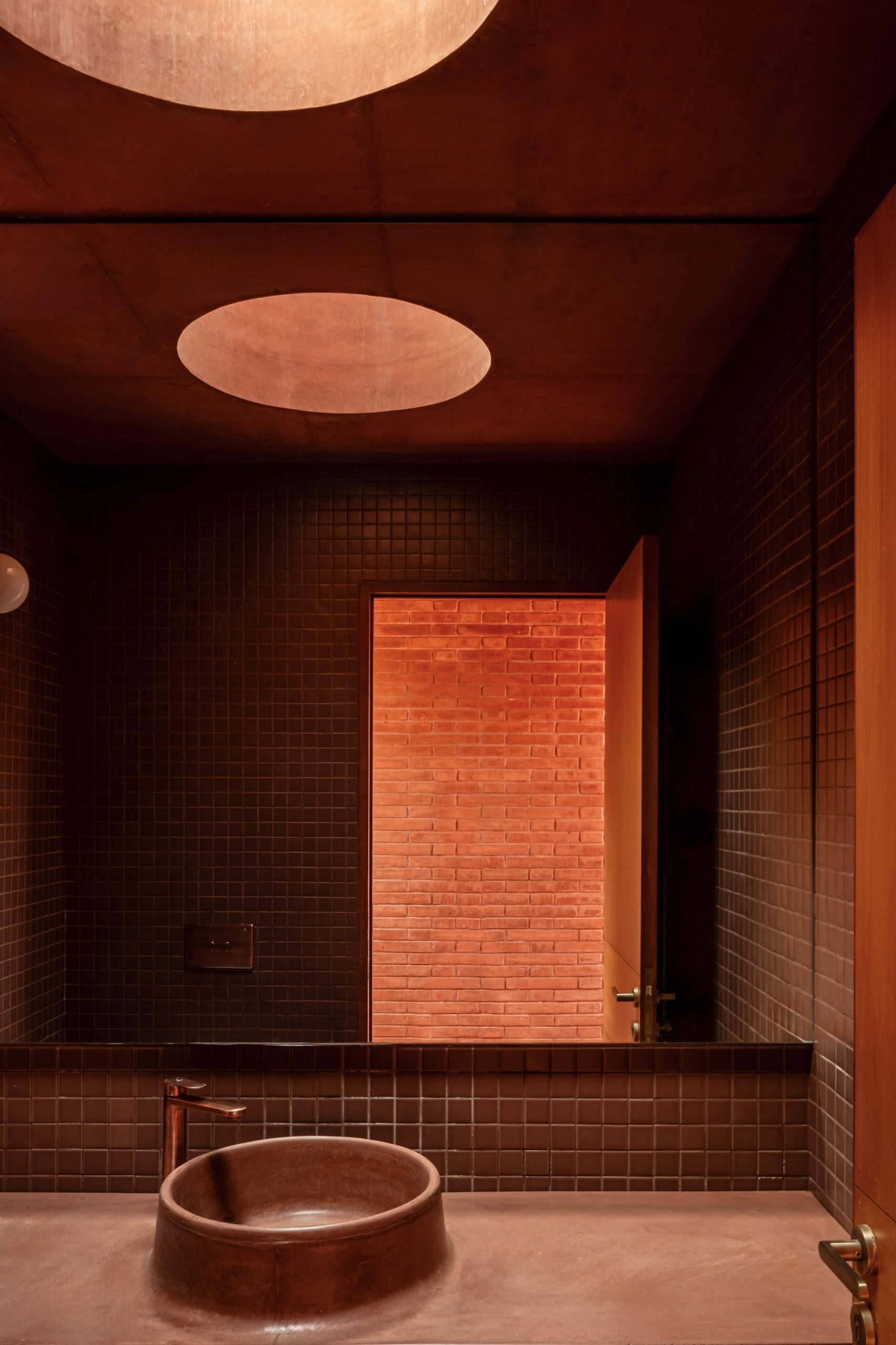 a detail of a contemporary brick home's bathroom