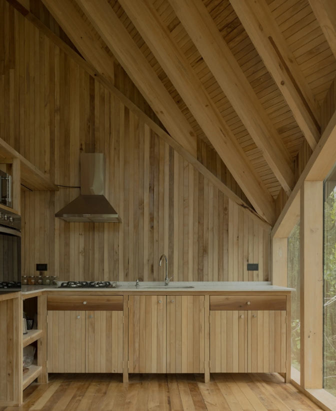 Cabin in Valdivia Chile kitchen wood cabinets