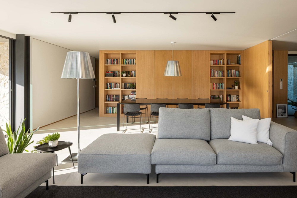 M House Concrete Structure House in Portugal Homedit dining area and library