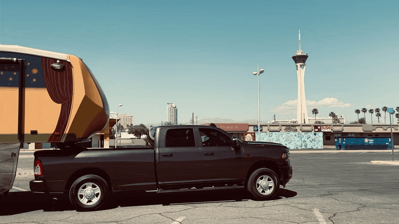 a gif of a camper with the office of collecting and design written on the side