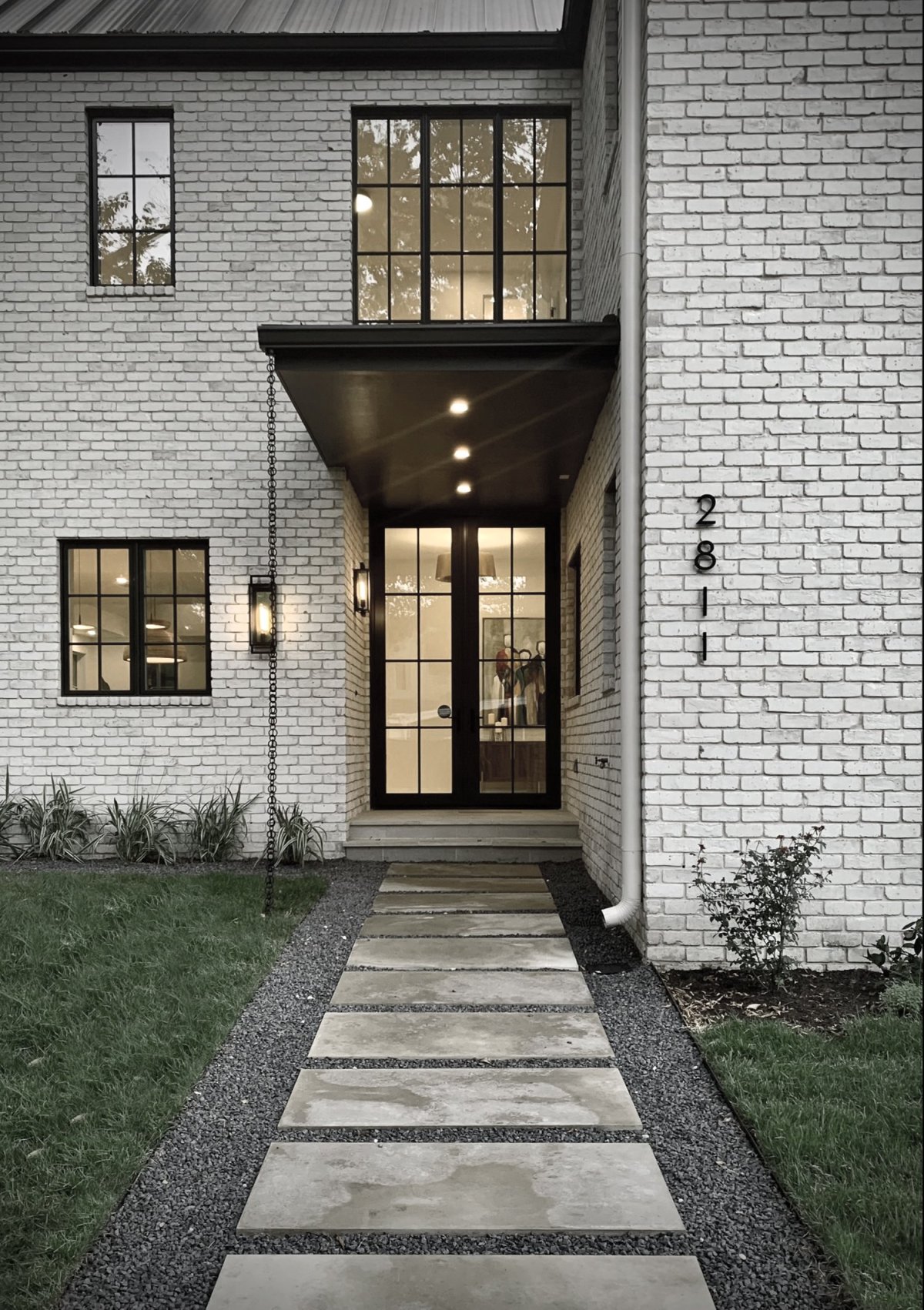 White brick house by Clark Richardson Architects entryway