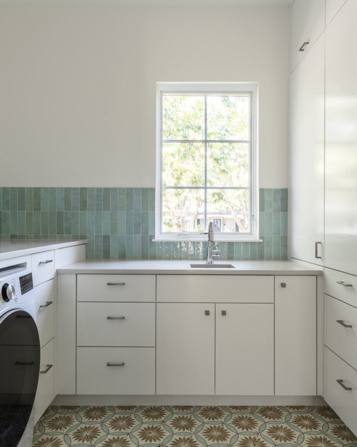 White brick house by Clark Richardson Architects laundry room