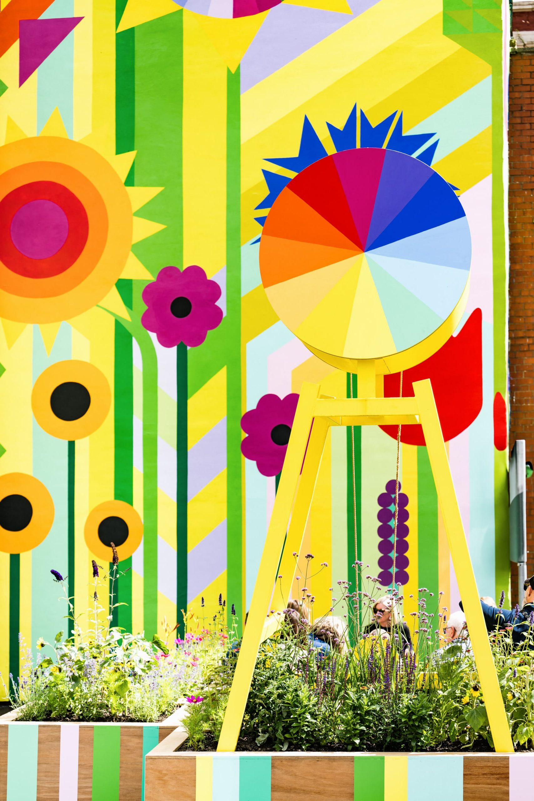 a detail of a vibrant floral and geometric mural