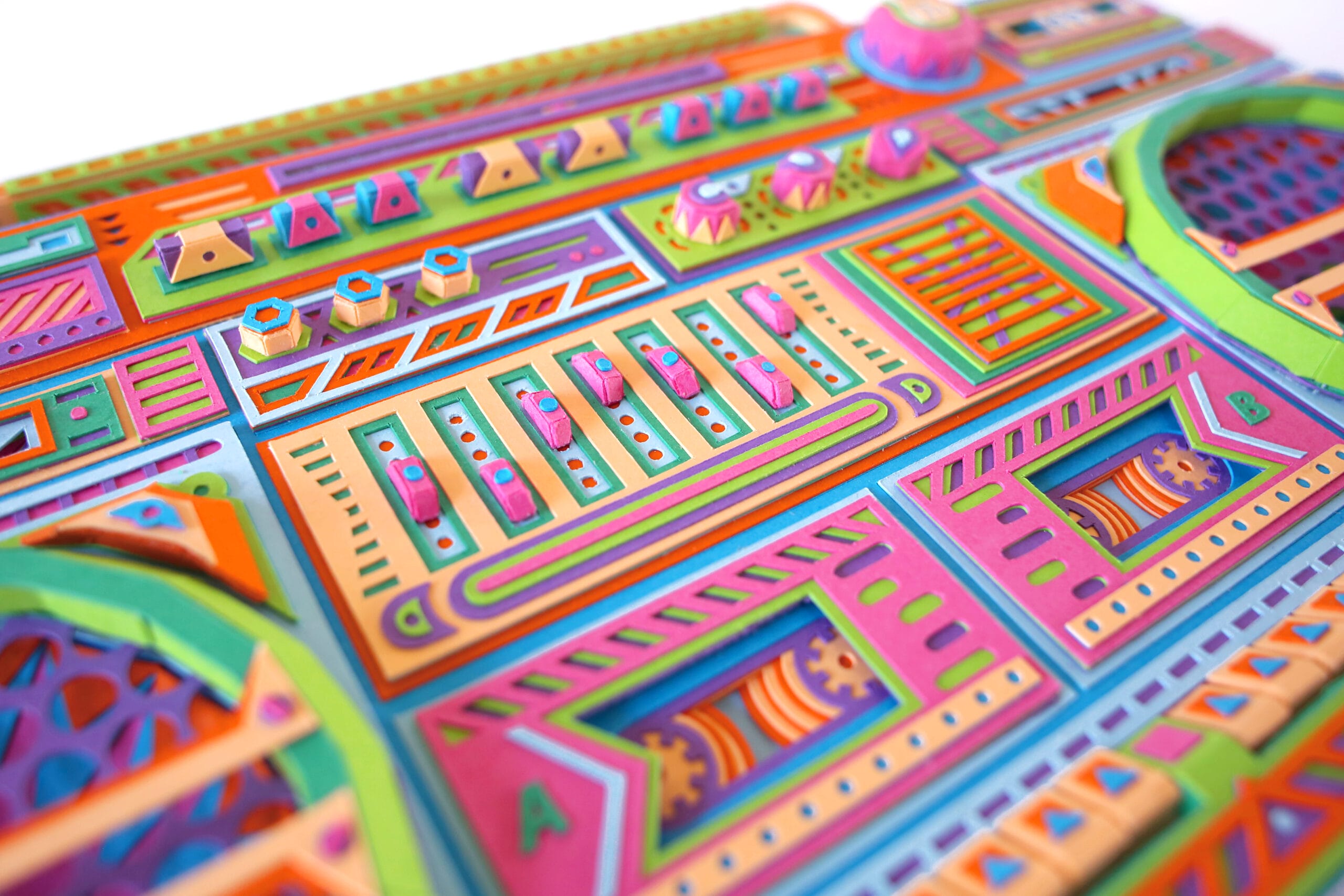 a detail of a colorful boombox made from paper