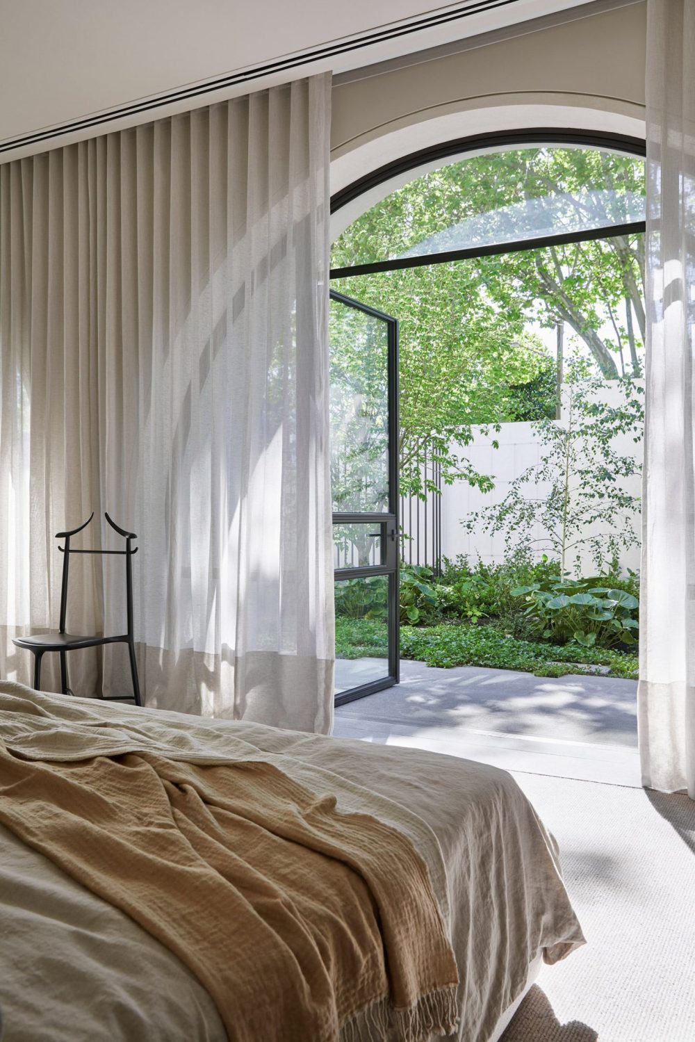 Apartment Complex with Ached Windows Bed area