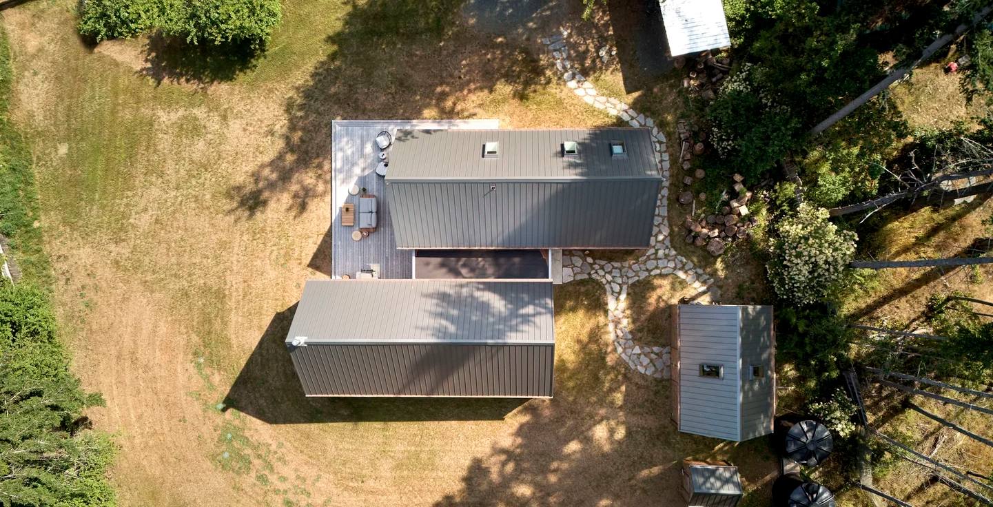 Forest cabin in cedar shingles architecture aerial view