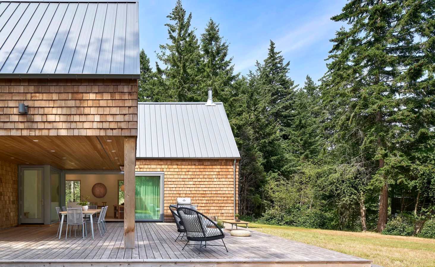 Forest cabin in cedar shingles deck patio