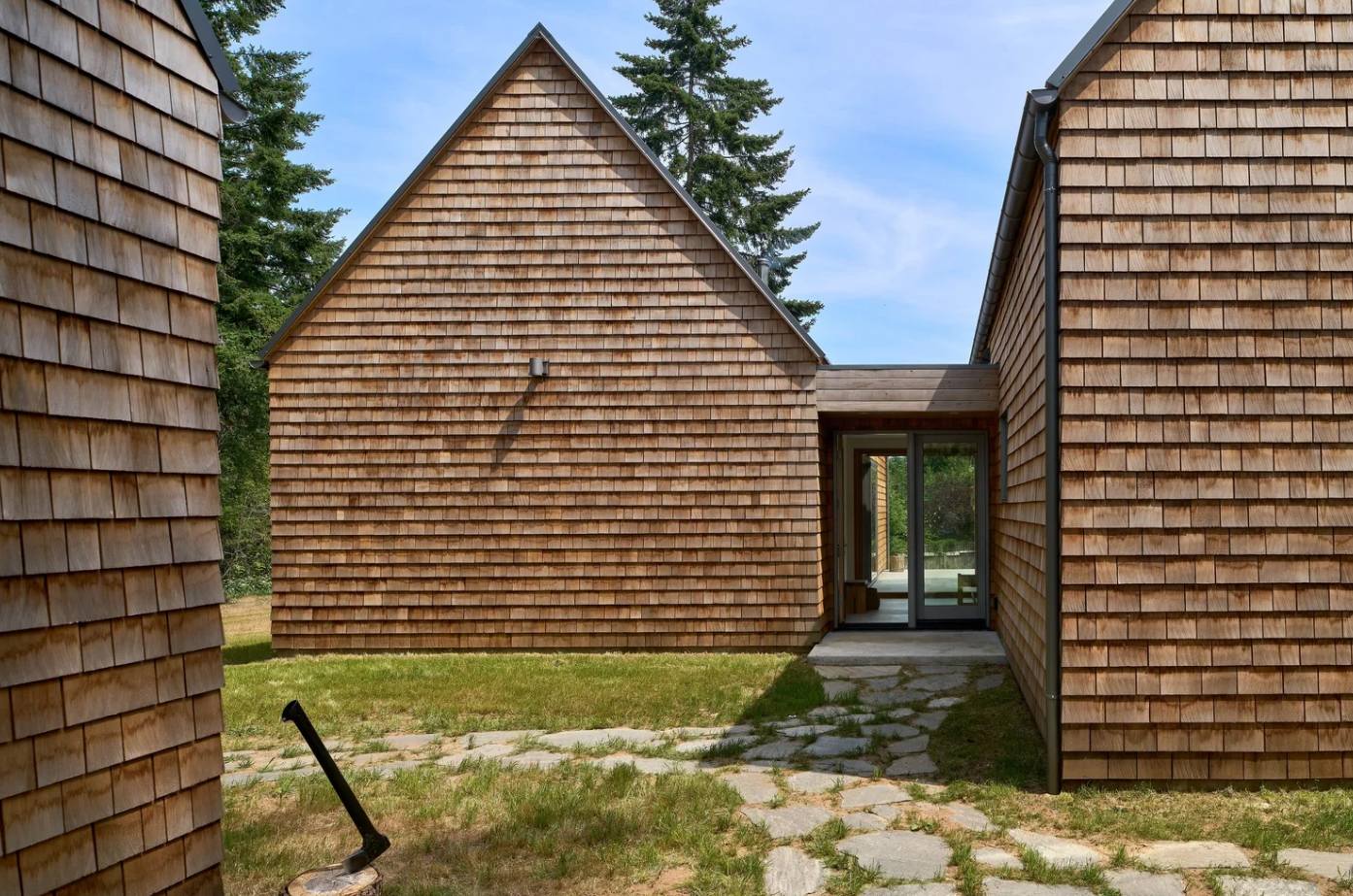 Forest cabin in cedar shingles exterior