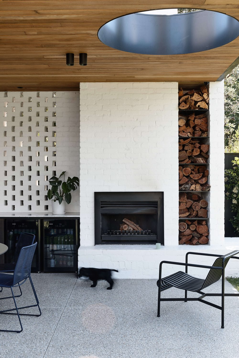 Four bed house by inform outdoor fireplace stack fire logs