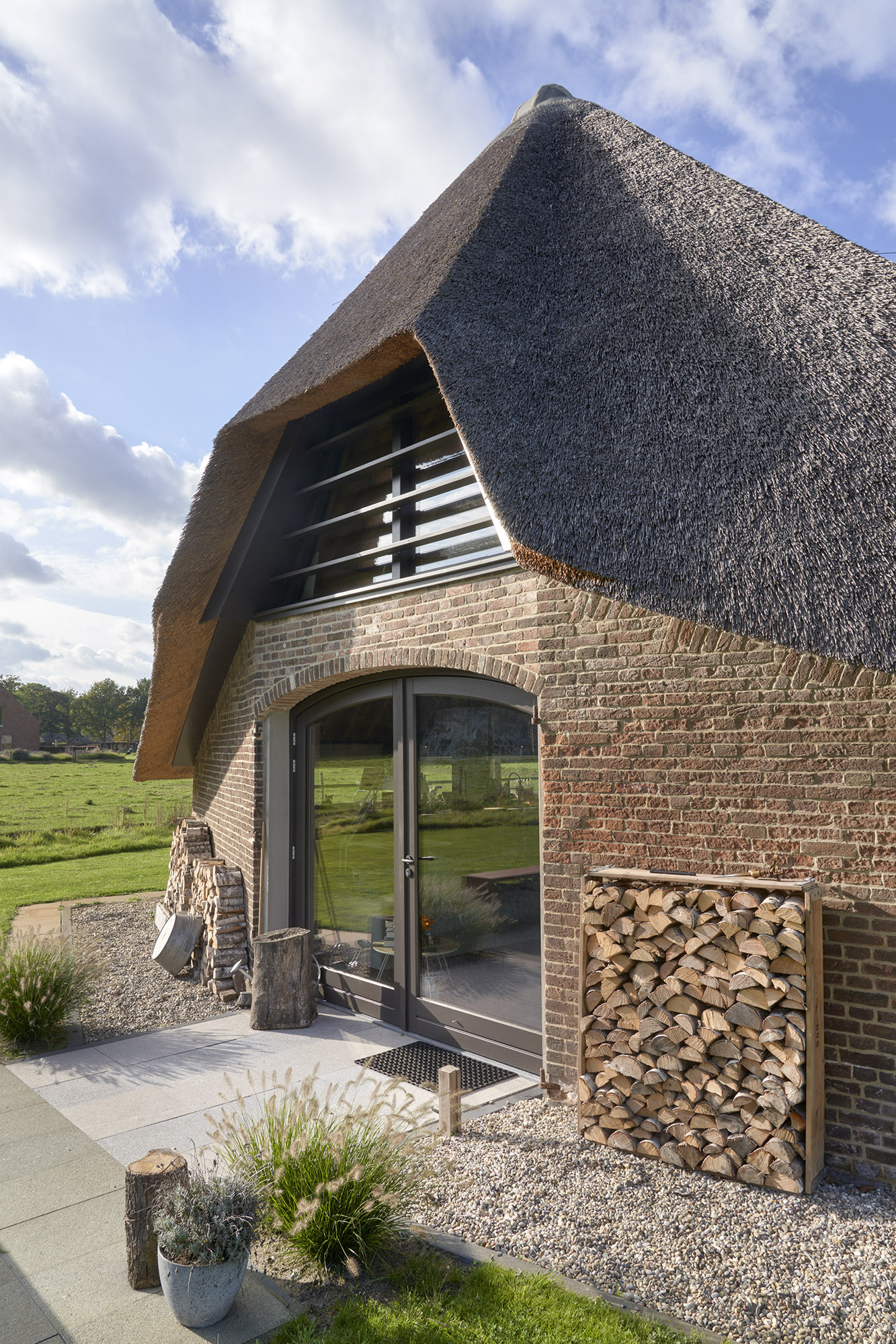 Brick sheepfold restauration by HilberinkBosch Architecten large windows