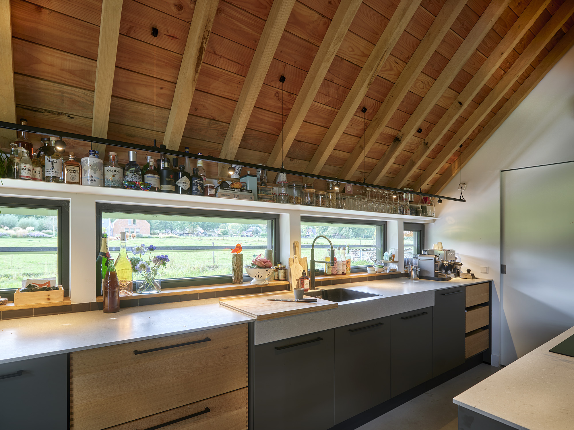 Brick sheepfold restauration by HilberinkBosch Architecten open storage modern kitchen