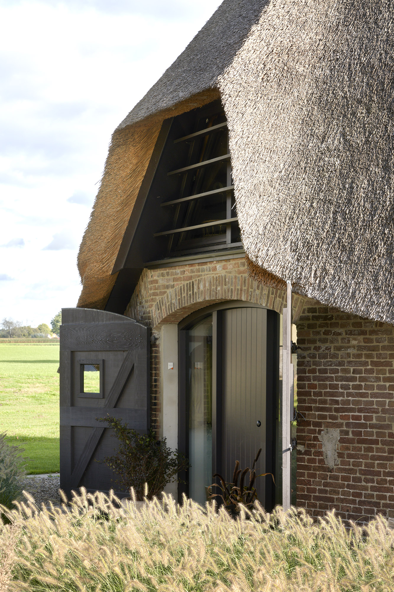 Brick sheepfold restauration by HilberinkBosch Architecten wood entrance
