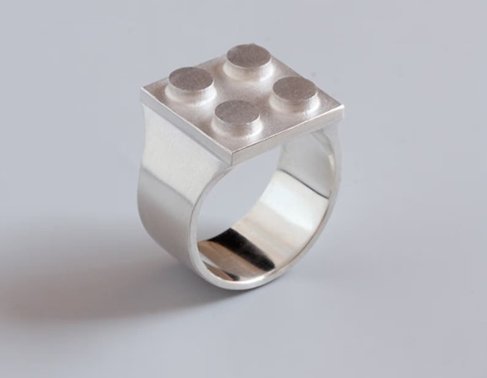 a sterling silver ring designed by Studio GOGO to fit a LEGO brick on top
