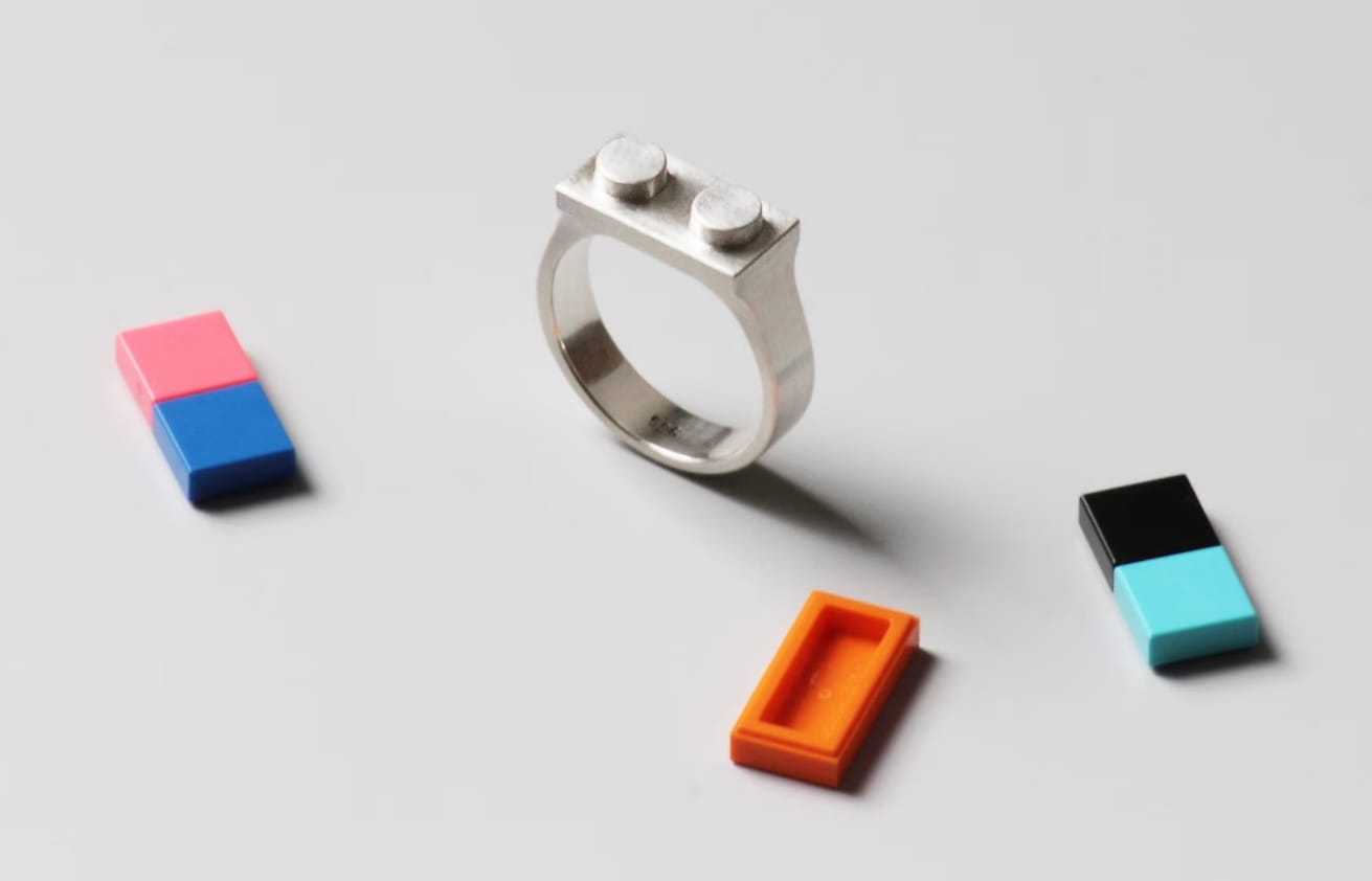 a sterling silver ring designed by Studio GOGO featuring colorful LEGO bricks that can be stuck to the top