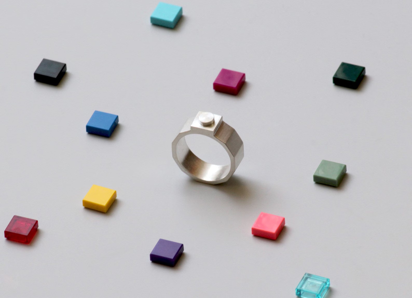 a sterling silver ring designed by Studio GOGO featuring colorful LEGO bricks that can be stuck to the top