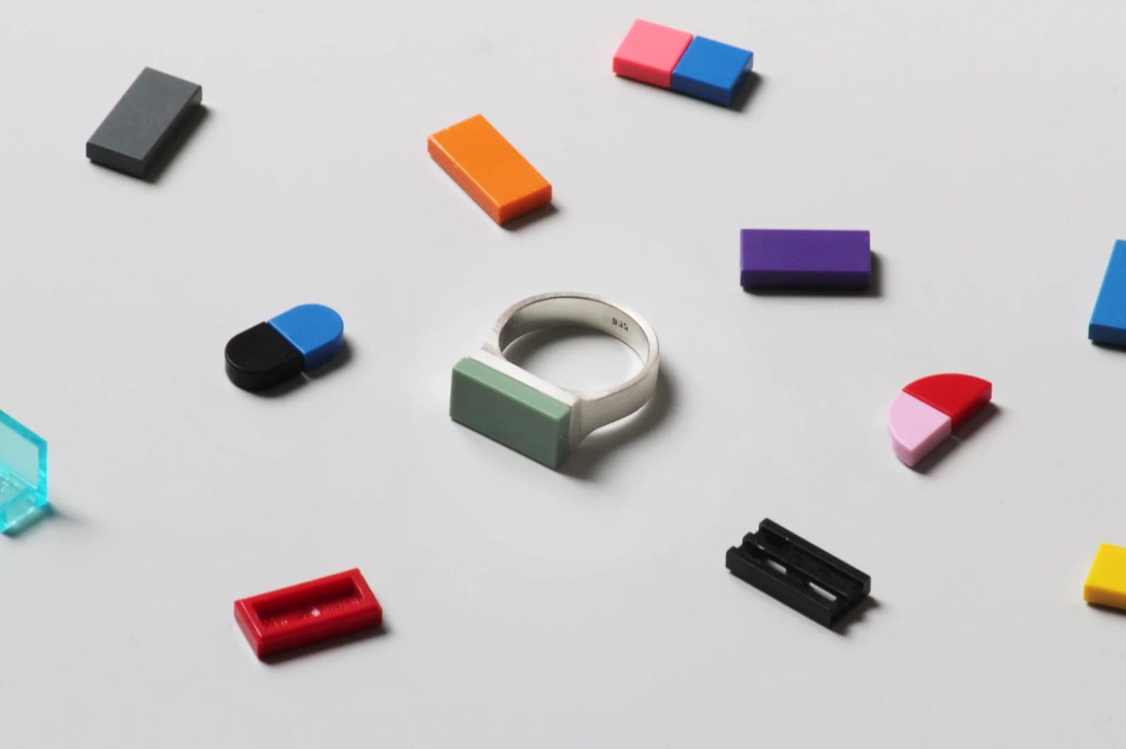 a sterling silver ring designed by Studio GOGO featuring colorful LEGO bricks that can be stuck to the top