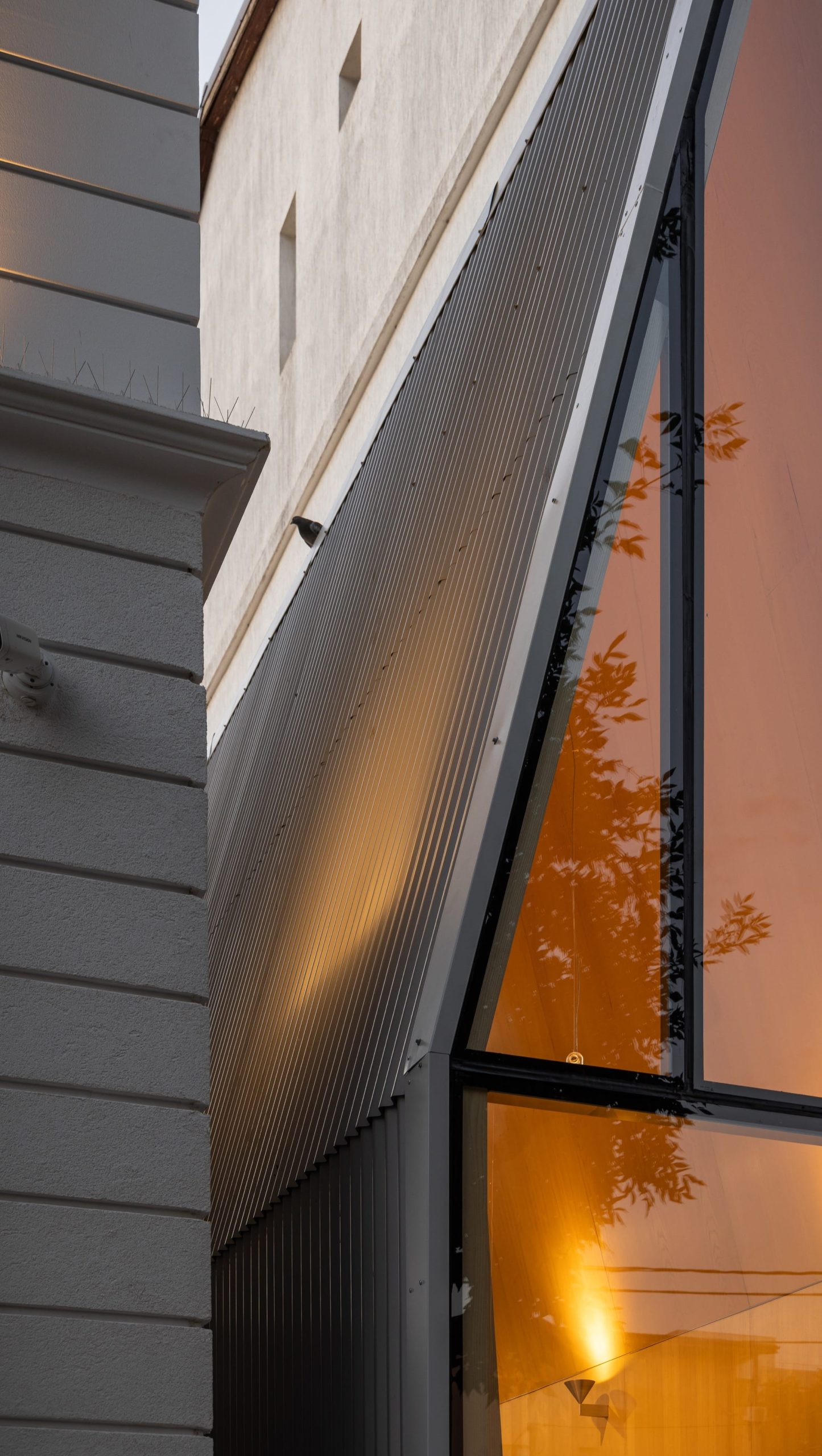 a detail of a tiny, narrow, contemporary cafe building