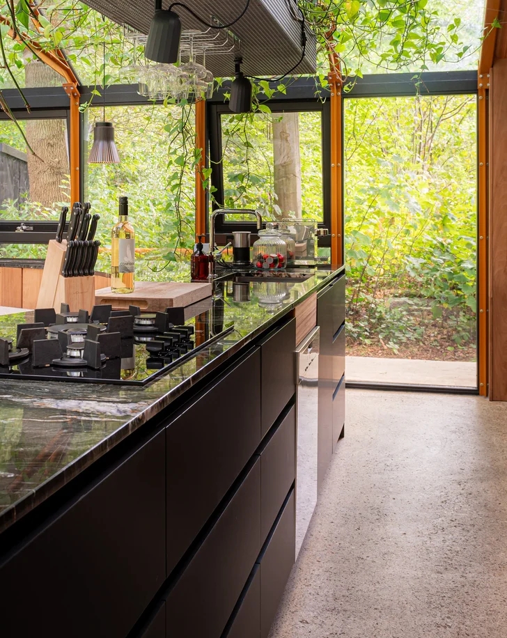 Glass Extension by GetAway Projects BV kitchen black cabinets