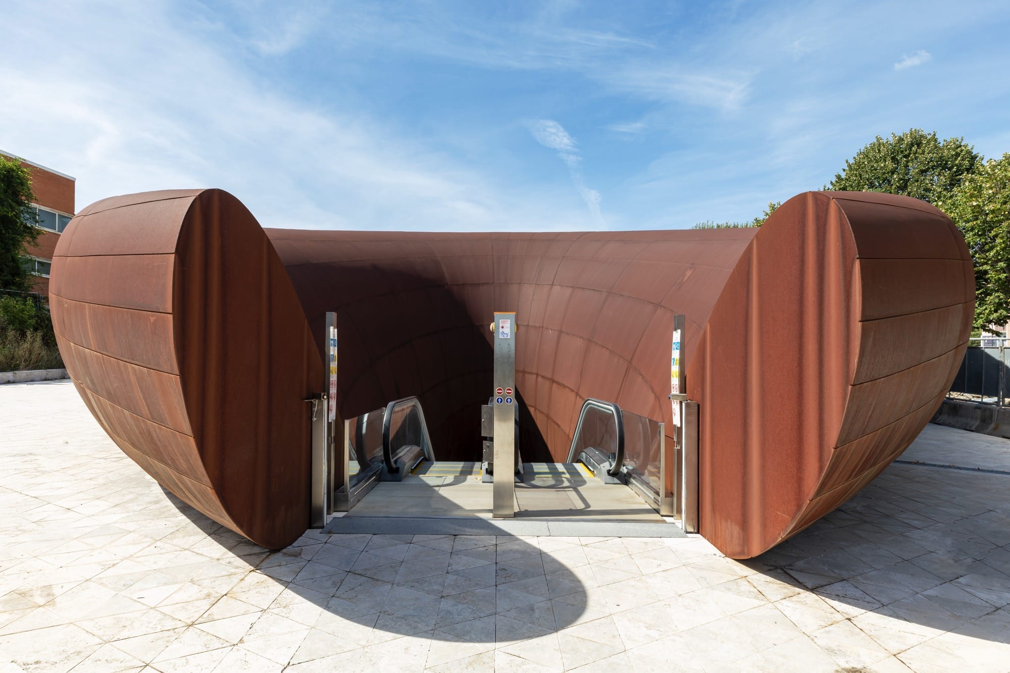 the entrance to a contemporary train station in Naples designed by Anish Kapoor