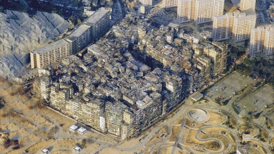 a still from a video by Sluda Builds showing a historical photograph of Kowloon Walled City