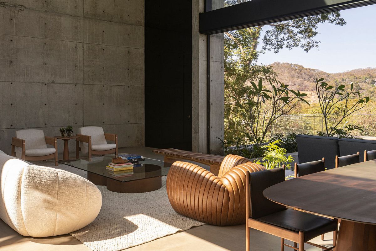 Concrete House by Dayala e Rafael Arquitetos Associado living room chairs