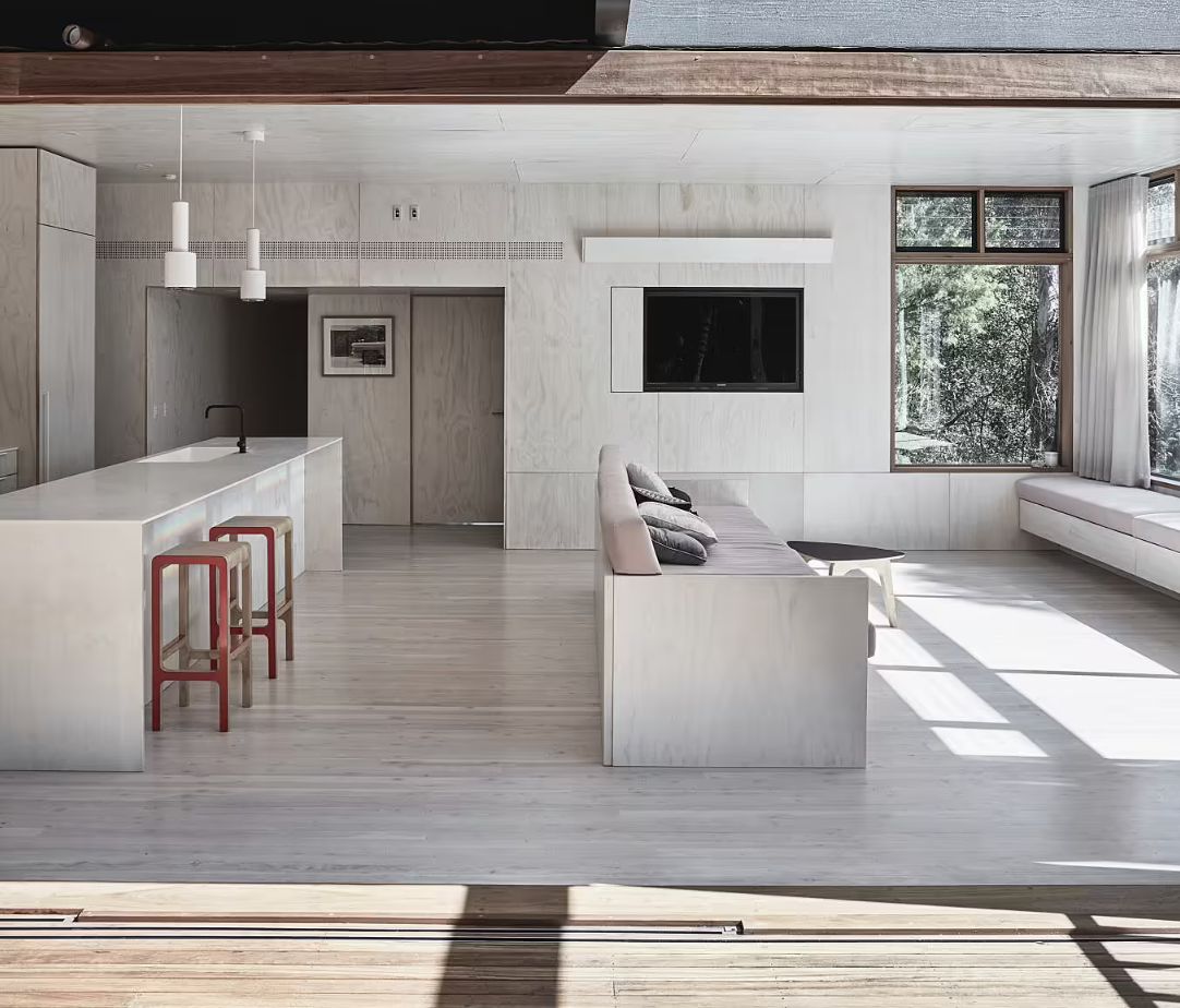 Rama Architecture Container House living ara divided by sofa