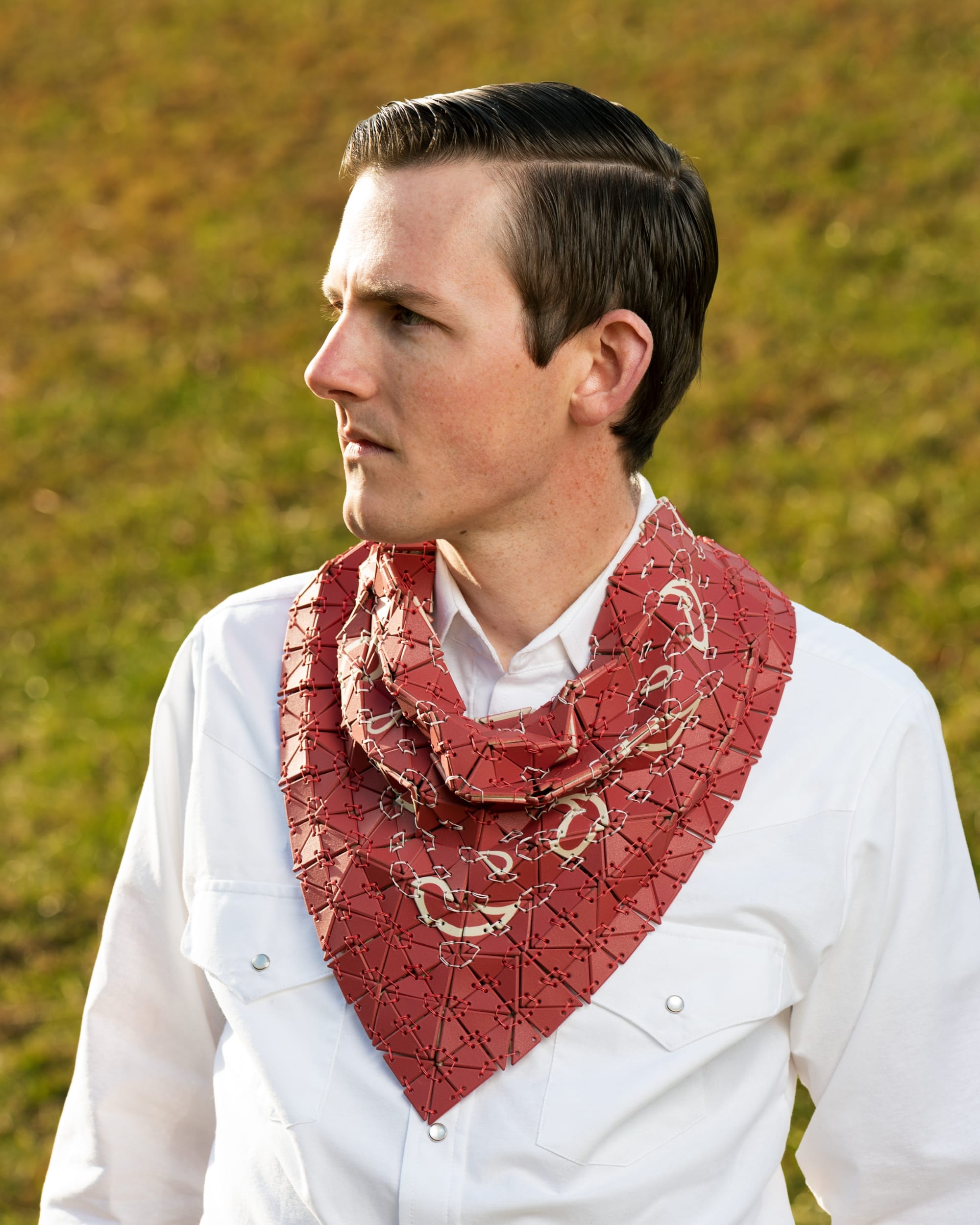 Shae Bishop wears a red tile bandana and looks to the left