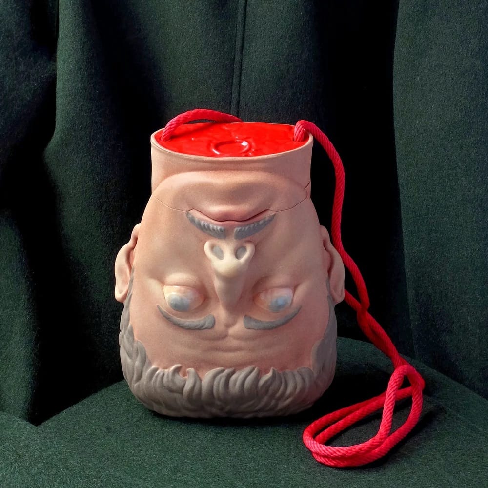 a sculptural purse designed by Paolo Puck in the shape of a disembodied head
