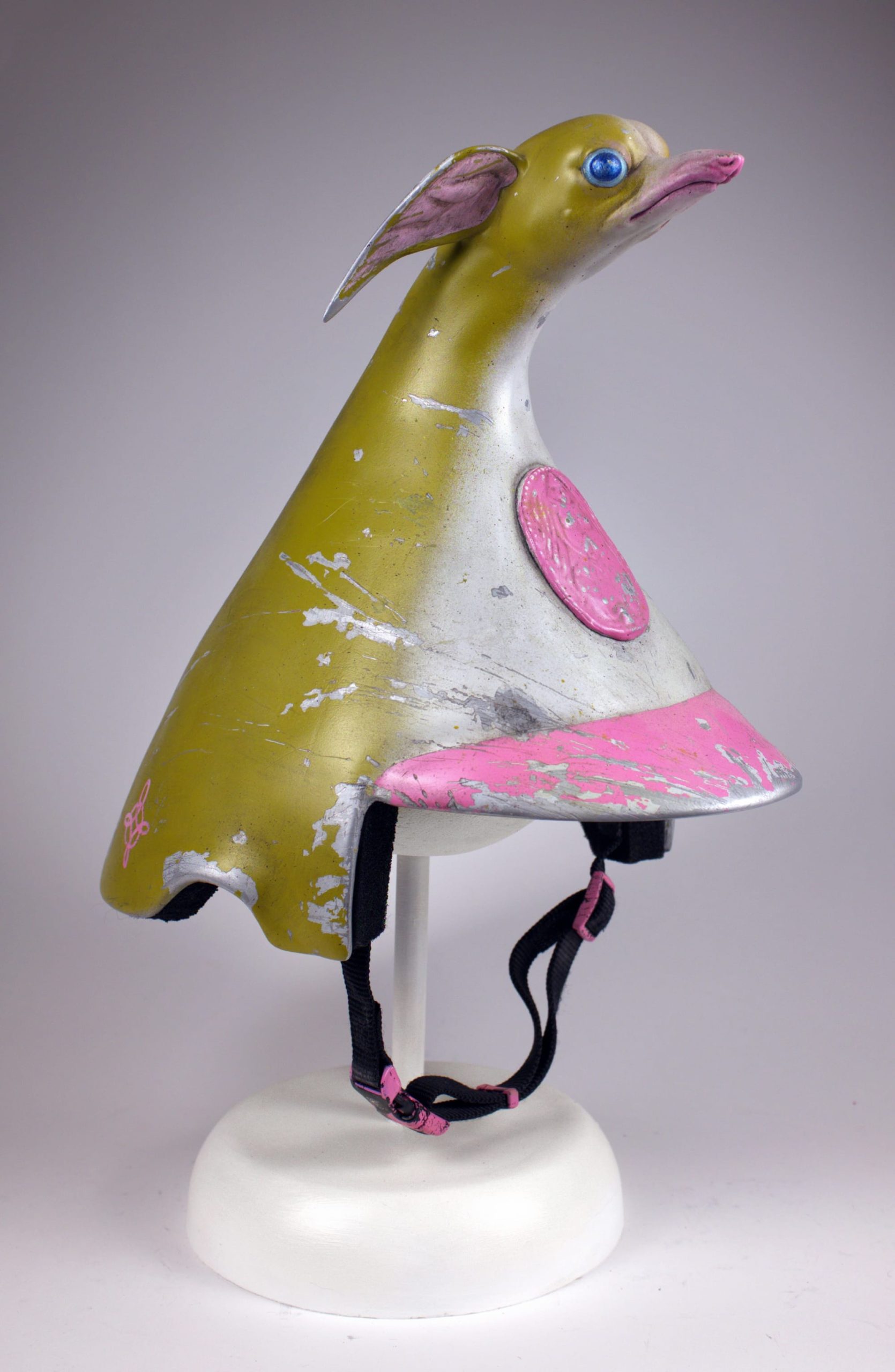 a metal helmet designed by Paolo Puck with a strange, chihuahua-like motif on the top