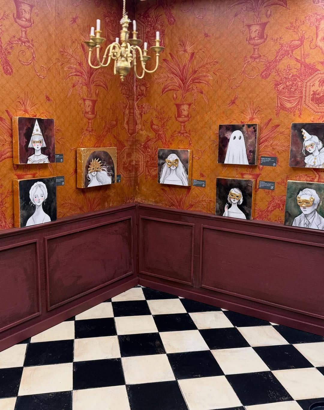 the interior of a 1/6-scale gallery with tiny paintings and a tiled floor