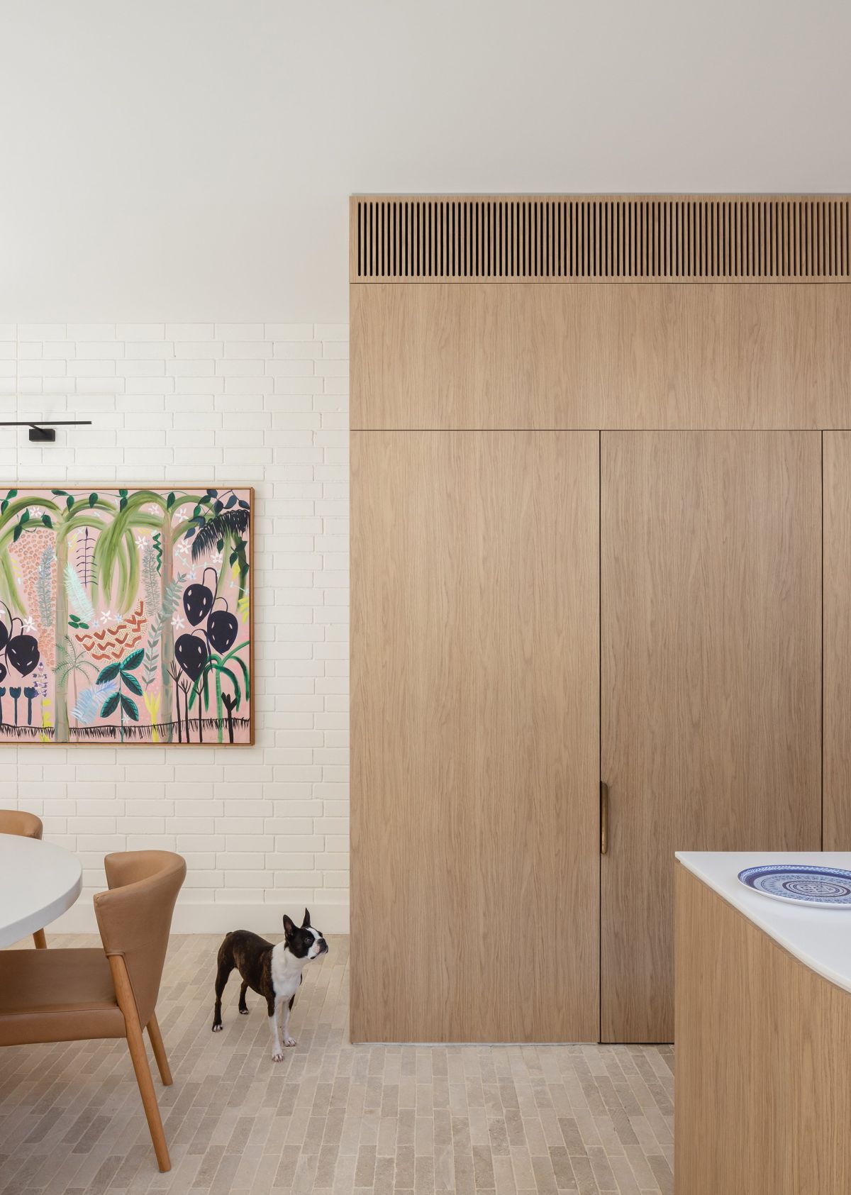 House Is a Playful Dance of Curves natural wood cabinets