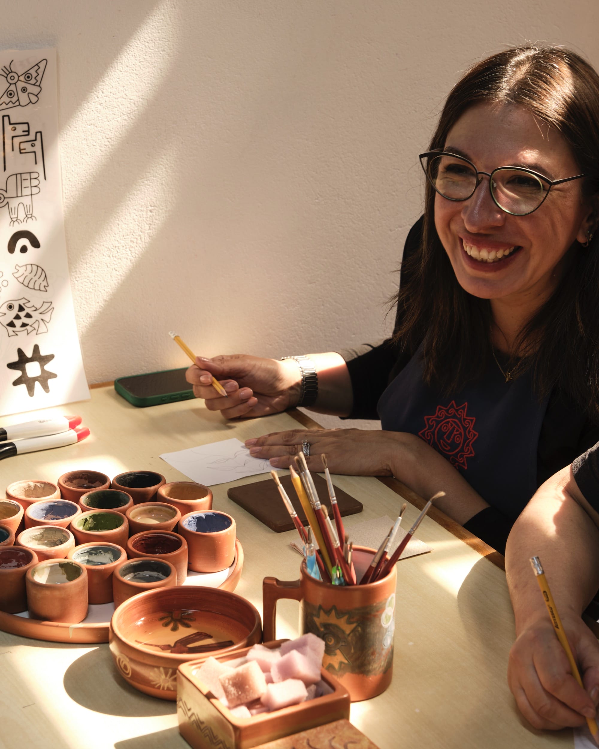 a woman working on a piece of clay